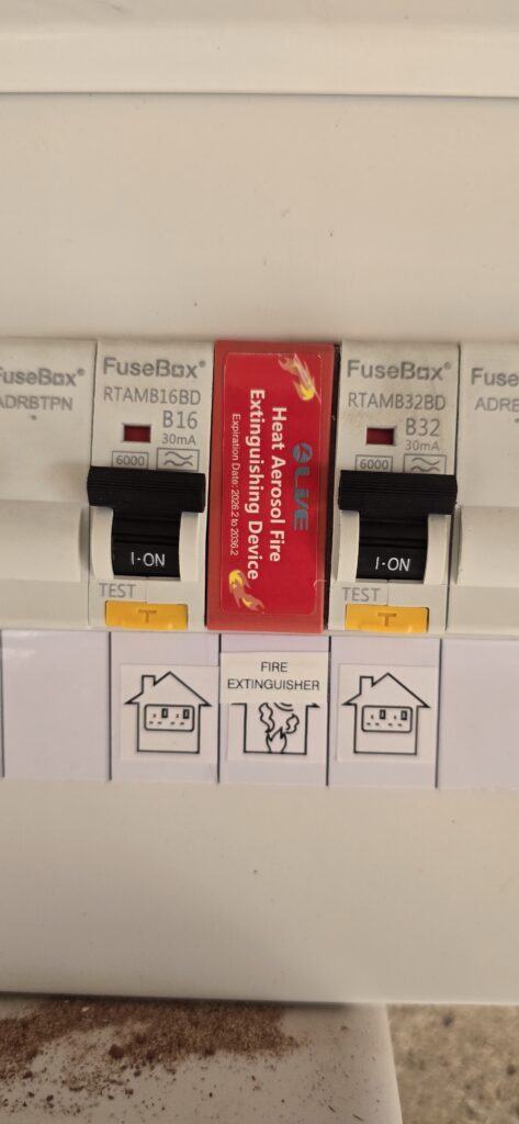 Modern metal consumer unit with RCBOs and DIN rail fire suppression device fitted by NextPhase Energy, electrician Goole, East Yorkshire