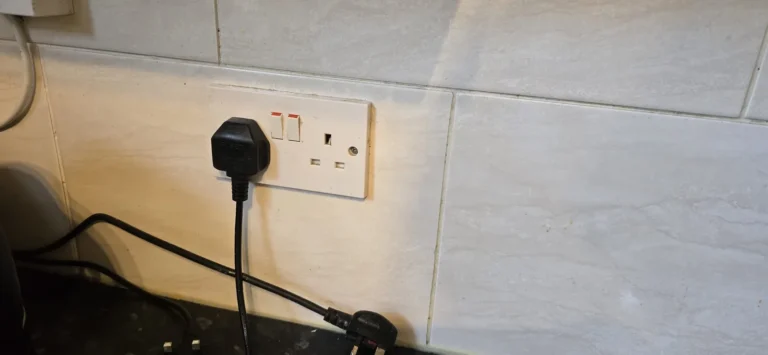 A double socket fitted to a wall