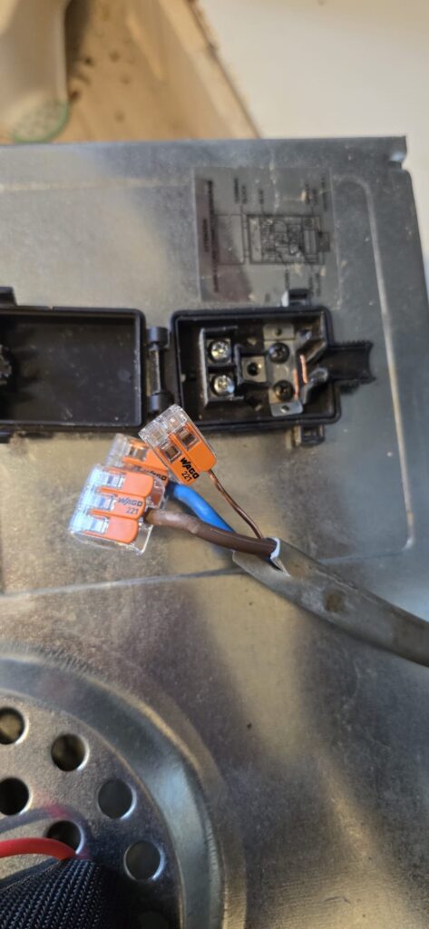 Cable disconnected from the back of an oven
