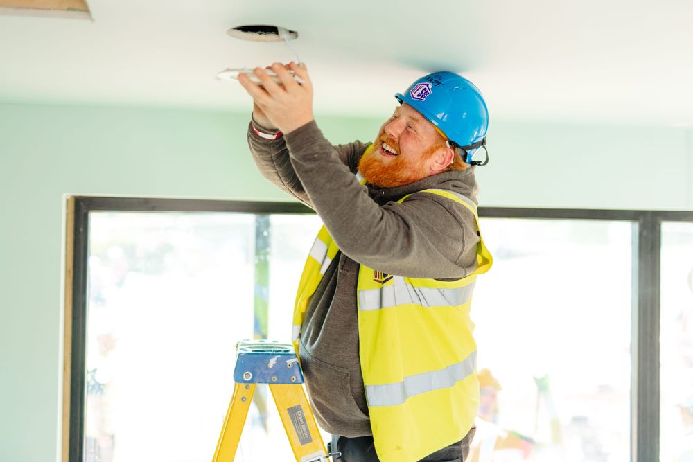 Matt Crabb fitting a downlight during a community build in Goole