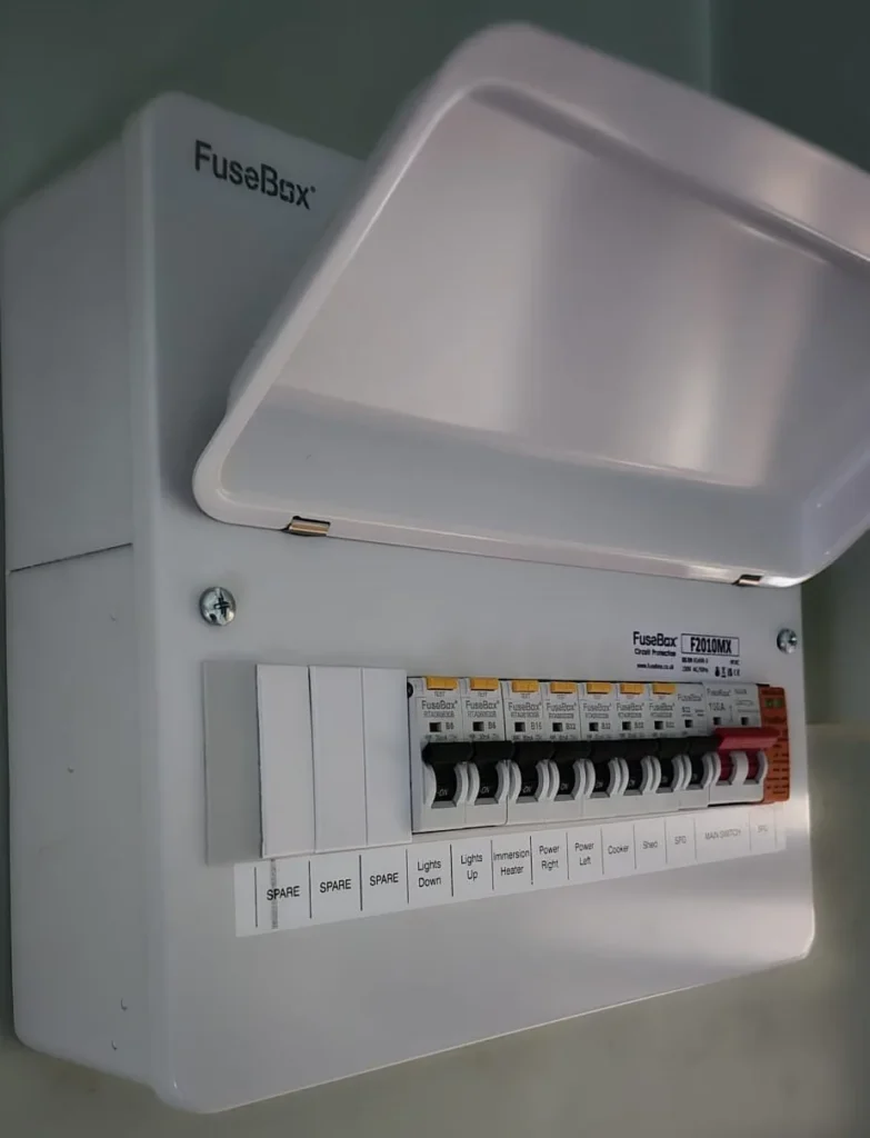 A newly fitted consumer unit with labelled circuits and the cover open