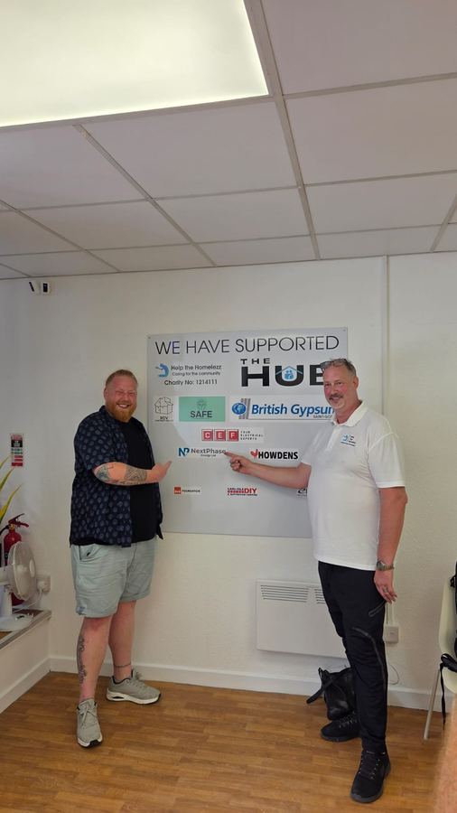 Matt pointing to the NextPhase Energy name on the supporters board at The Hub in Goole